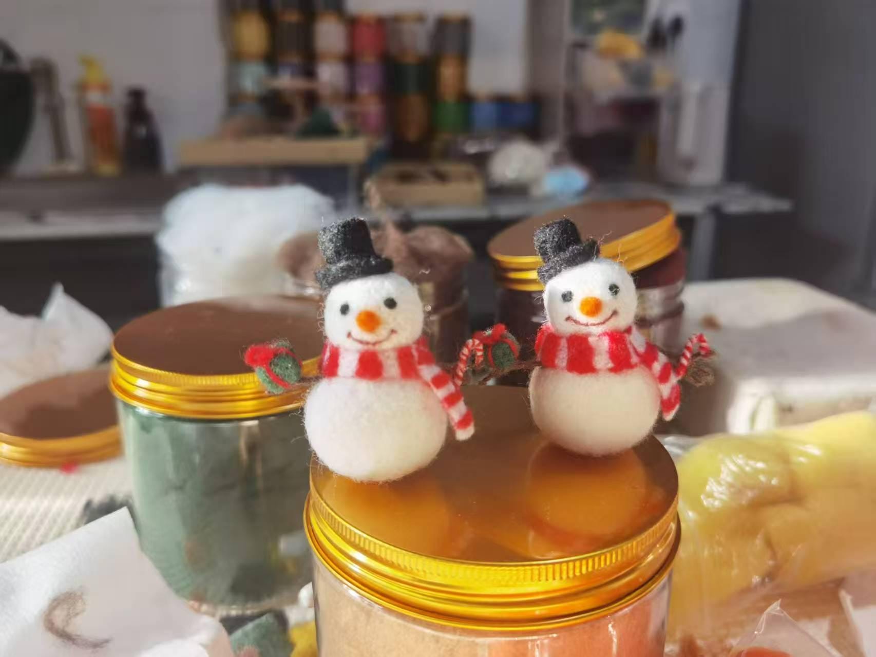 Needle felted wool snowman figurine ornament with a festive design, crafted by wwwilovefelt, perfect for Christmas tree decoration.