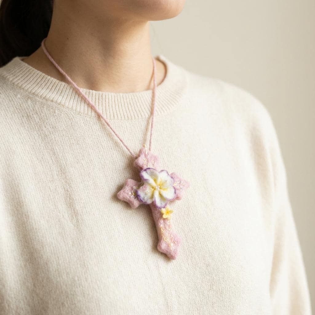 Hand felted wool floral cross pendant from Jiajia Felt Studio, showcasing detailed felt jewelry with colorful wool flowers.
