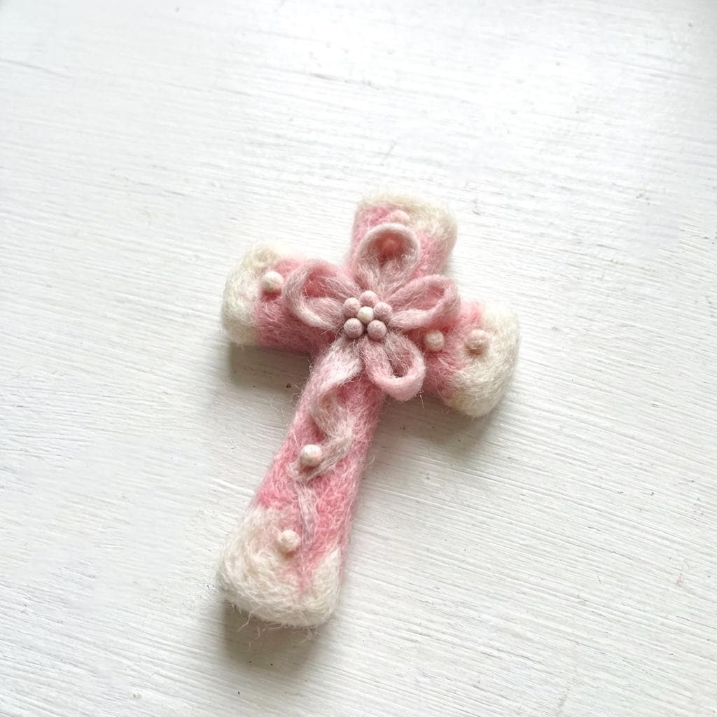 Hand felted wool floral cross pendant by Jiajia Felt Studio, featuring colorful wool flowers on a felt jewelry cross.