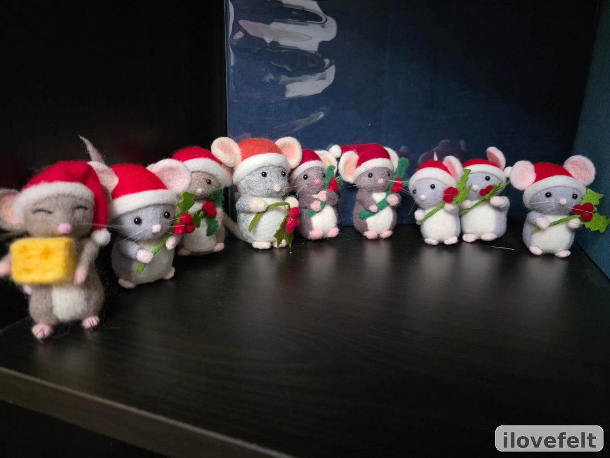 Real studio photo of a group of finished handmade Christmas wool mouse figurines by ilovefelt