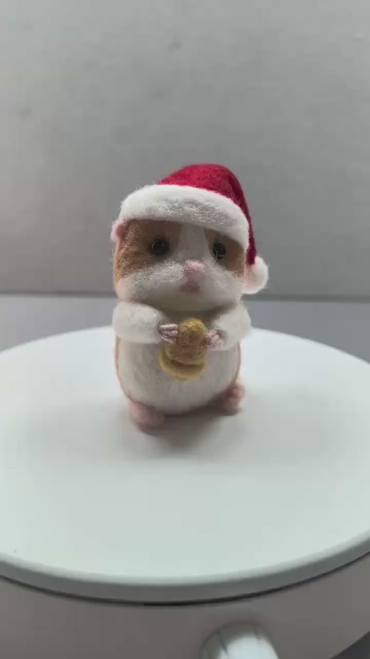 360-degree turntable view of a needle felted hamster in a Santa hat