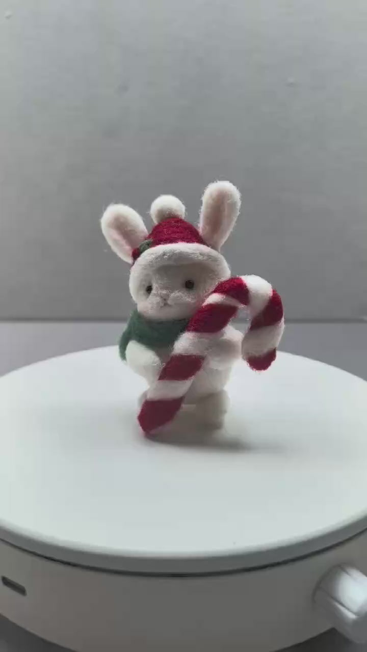 360-degree turntable view of a needle felted bunny with a candy cane
